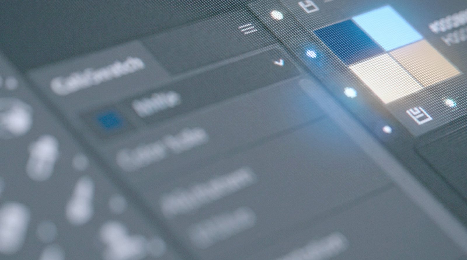 A colour panel in design software showing blue and tan swatches